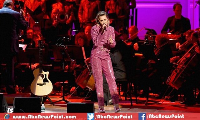 Miley Cyrus drops down her dress, Dances Just in Pair of Red Tights1